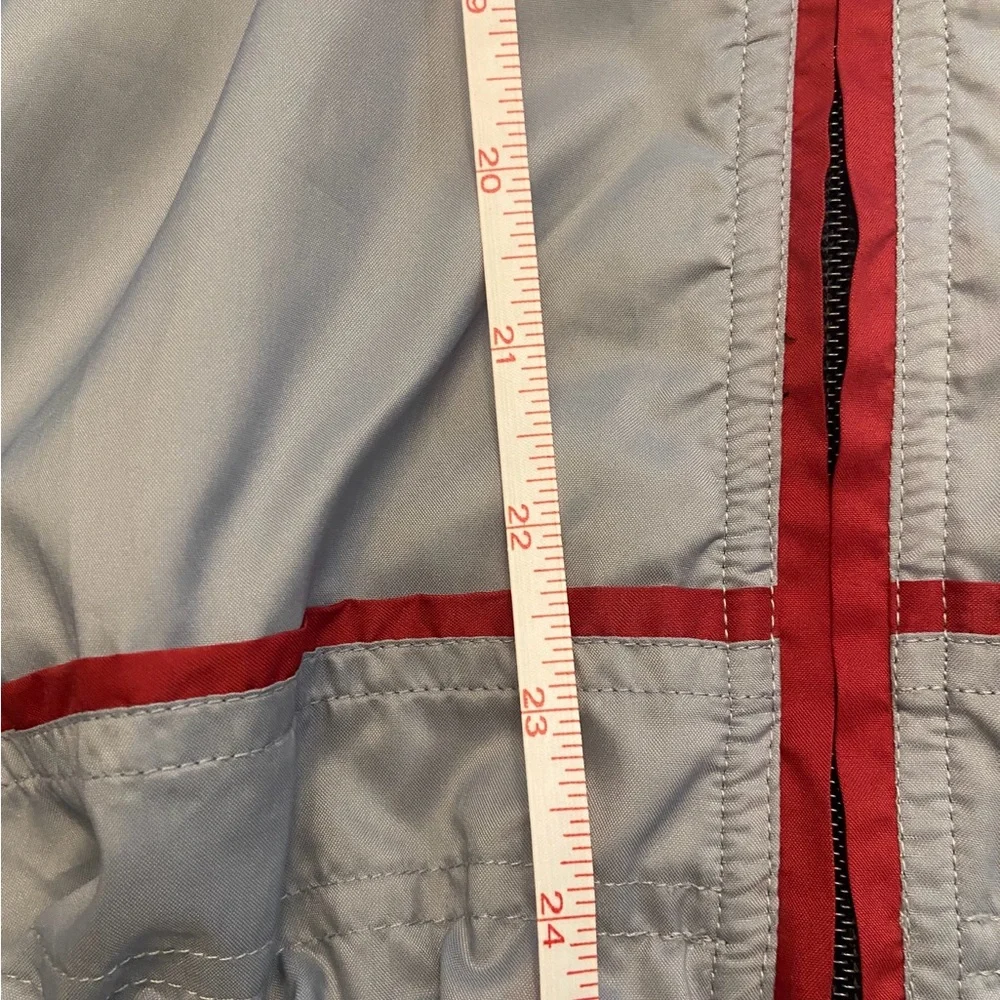 The North Face Men's Gray Windbreaker with Red Accents Size M.